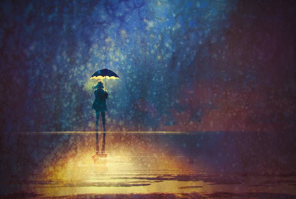 Eenzaam meisje in de regen
