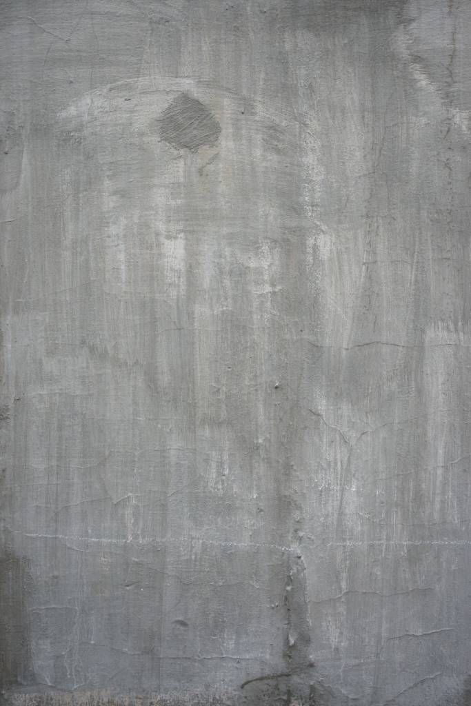 Behang met een grijze betonwand
