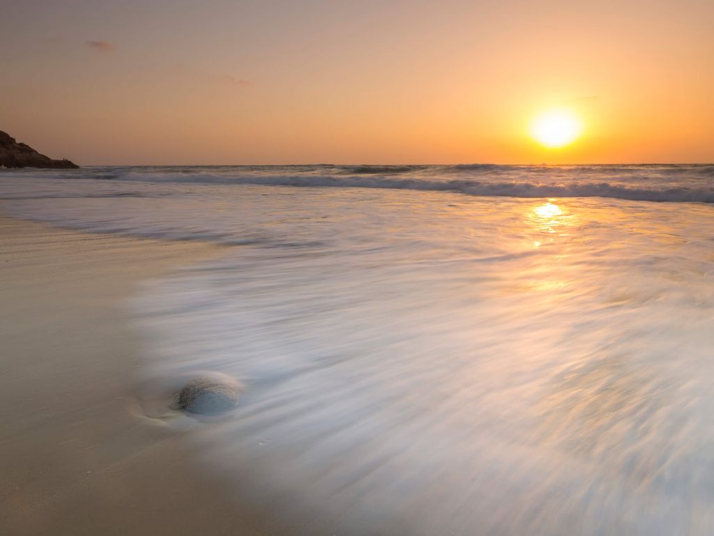 Zonsondergang bij het strand