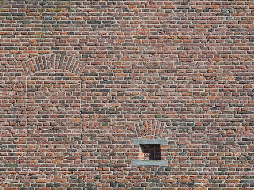 Voormalig raam in muur van bakstenen