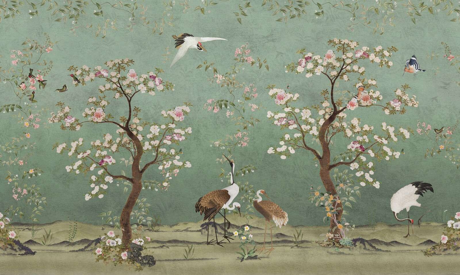 Sierlijke kraanvogels in bloesemlandschap