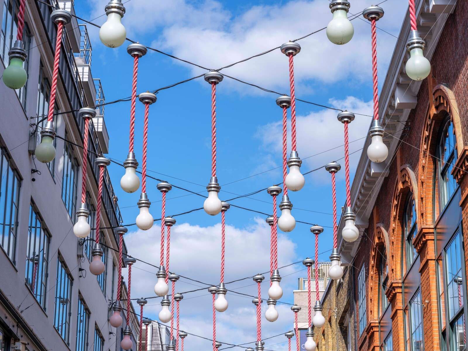 Light bulbs hanging across the buildings for Christmas decorations, London